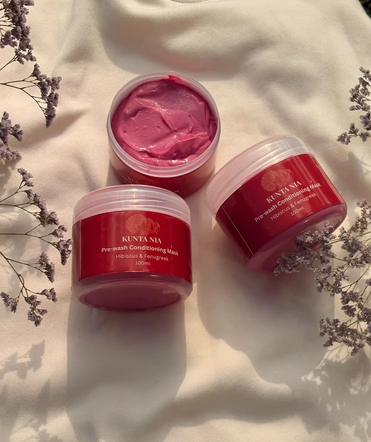 Kunta Nia Pre-wash Conditioning Mask, Hibiscus & Fenugreek: two closed jars and one open jar showing the pink mask